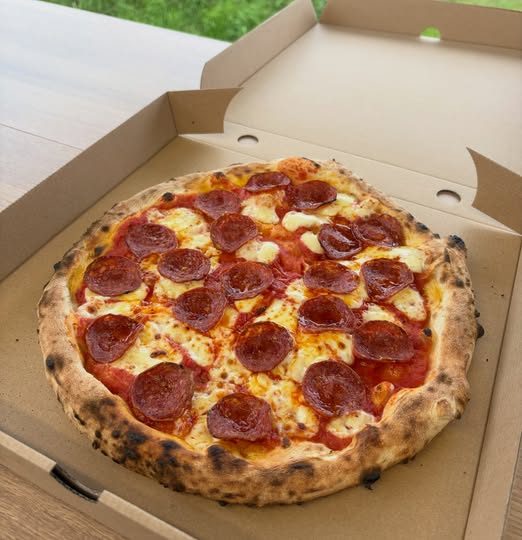 Stonebaked pepperoni pizza with a leopard-spotted crust